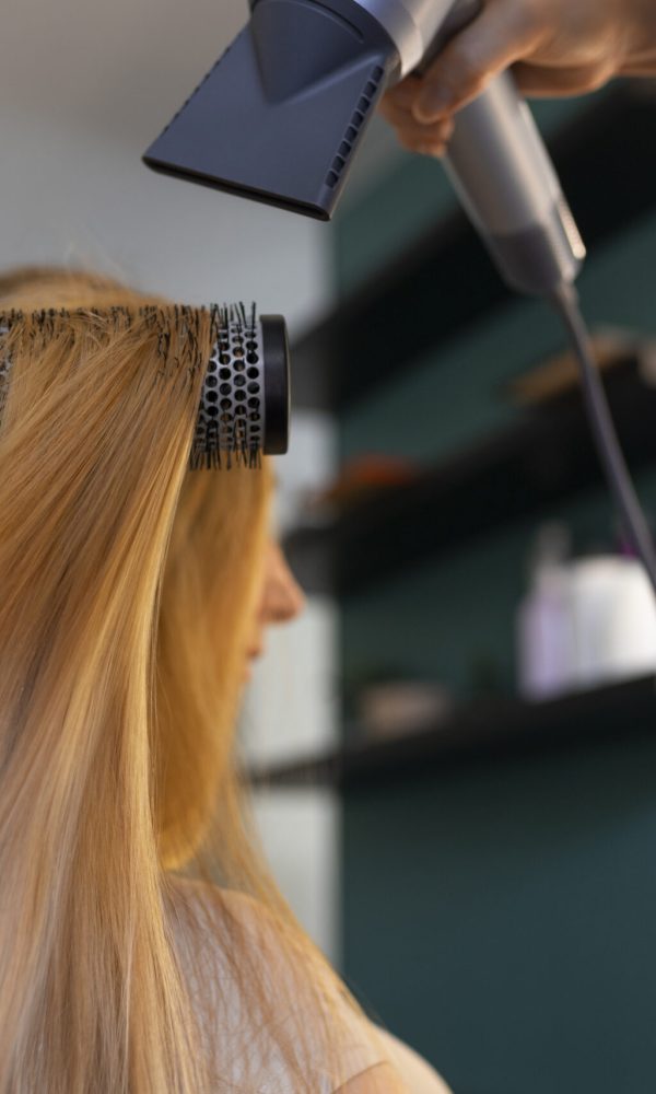 female-client-getting-her-hair-done-hairdresser